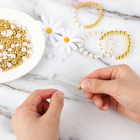 DECYOOL 1800Pcs Jewelry Making Kit - 1500Pcs Gold Round Spacer Smooth Loose Ball Beads, 150Pcs Alphabet, 150Pcs White Pearls and 2 Rolls Elastic S...